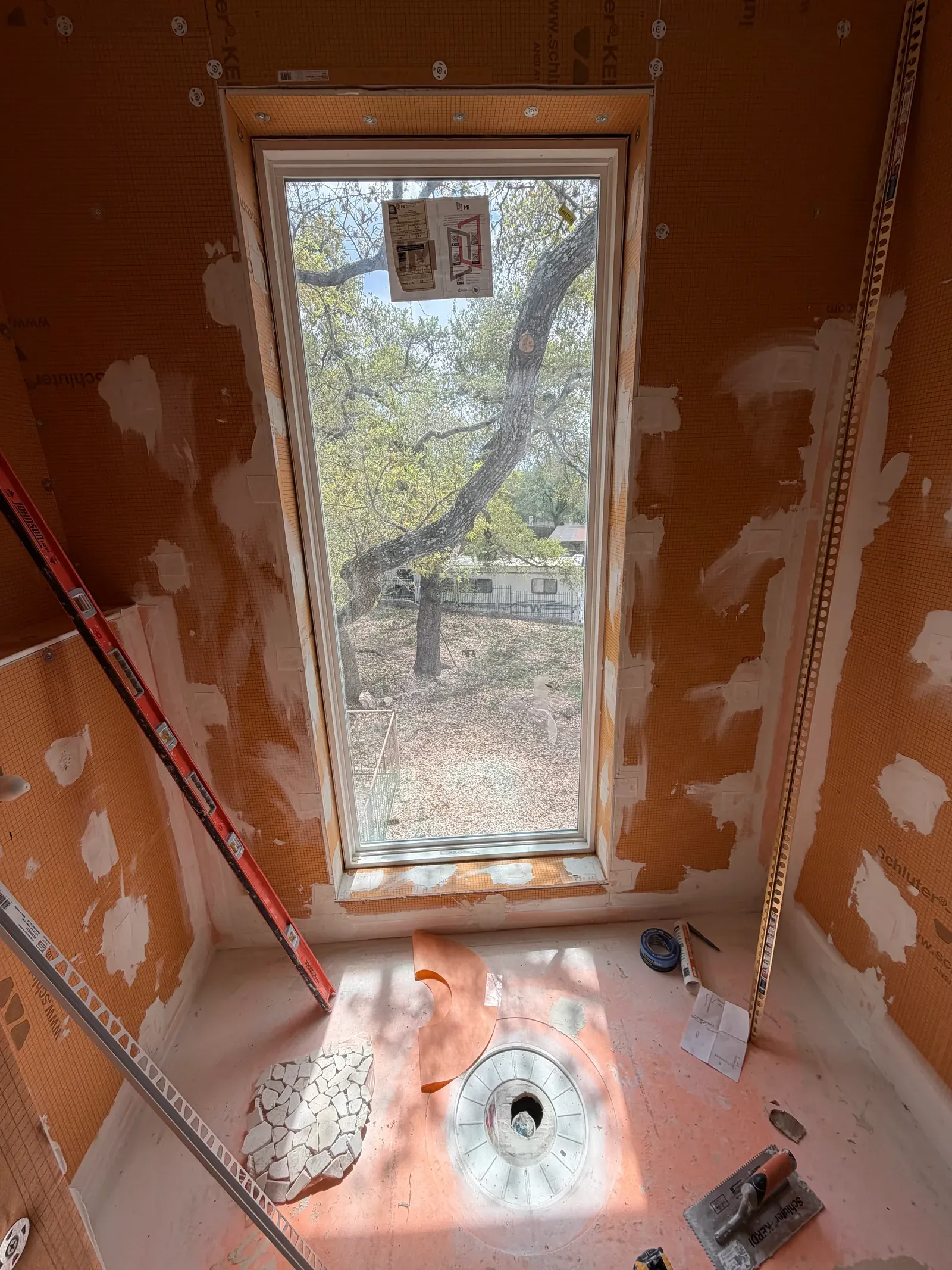 KERDI waterproofing membrane and shower pan installed and sealed before tile