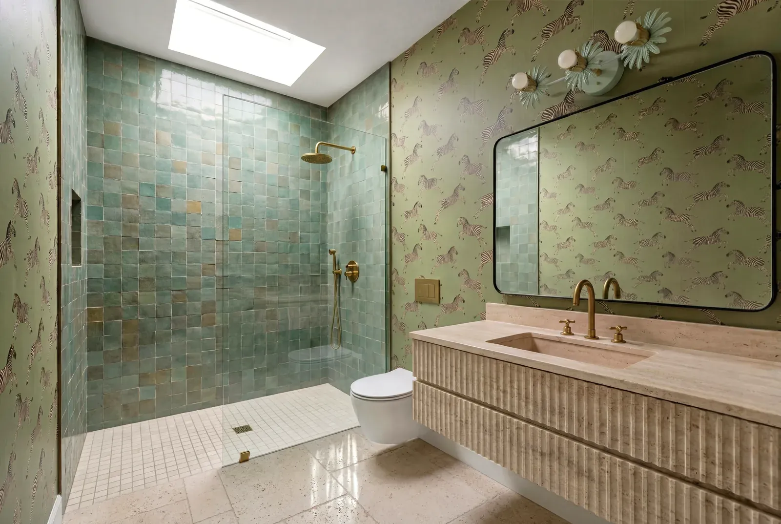 Bathroom remodel in Rosedale, Austin, TX with green zellige tile and a fluted stone vanity