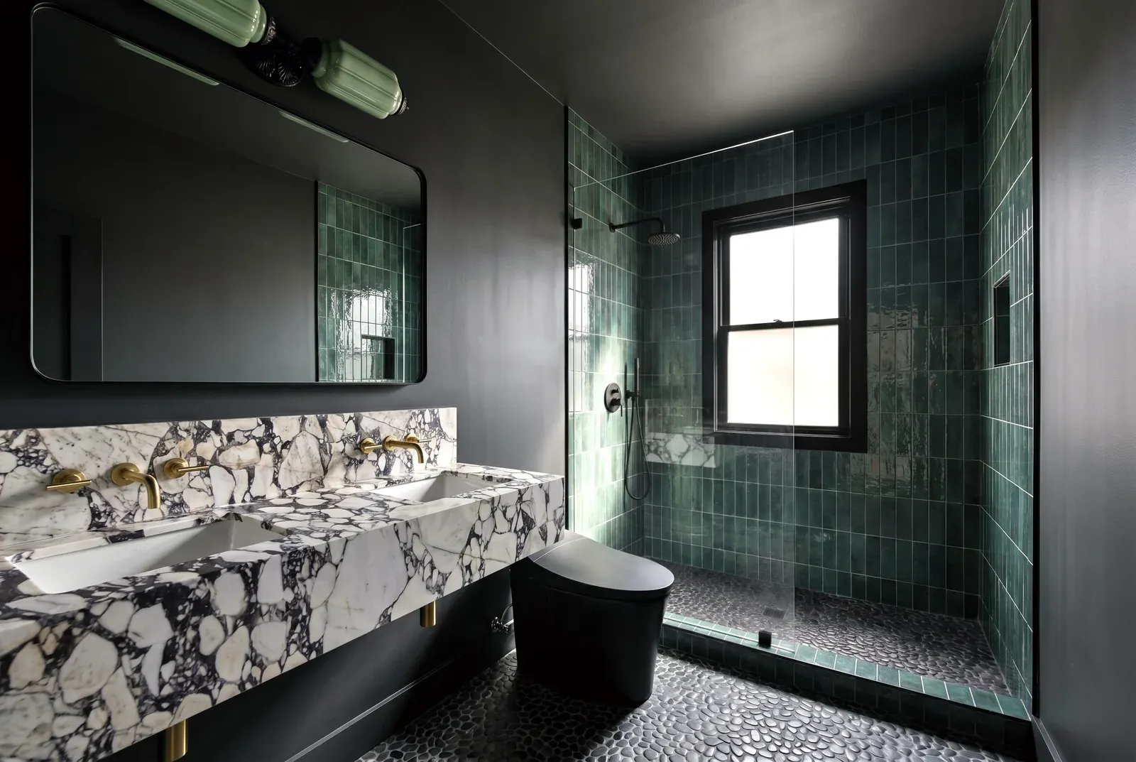 Bathroom remodel in Tarrytown, Austin, TX with green tile walls and a marble vanity