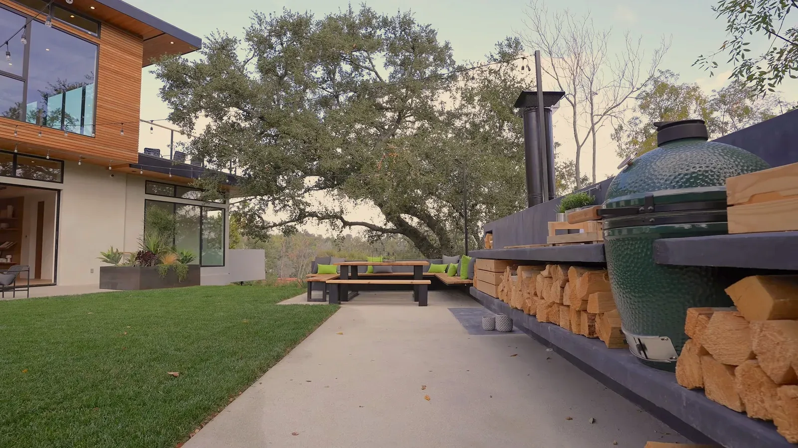 Exterior remodel in Allandale, Austin, TX with a concrete patio and a built-in outdoor kitchen