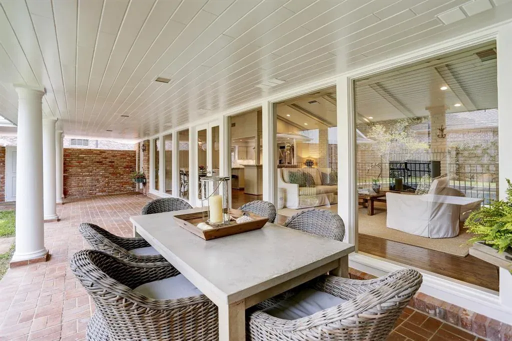 Before: Exterior remodel in East Austin, Austin, TX with a white paneled porch and brick paving