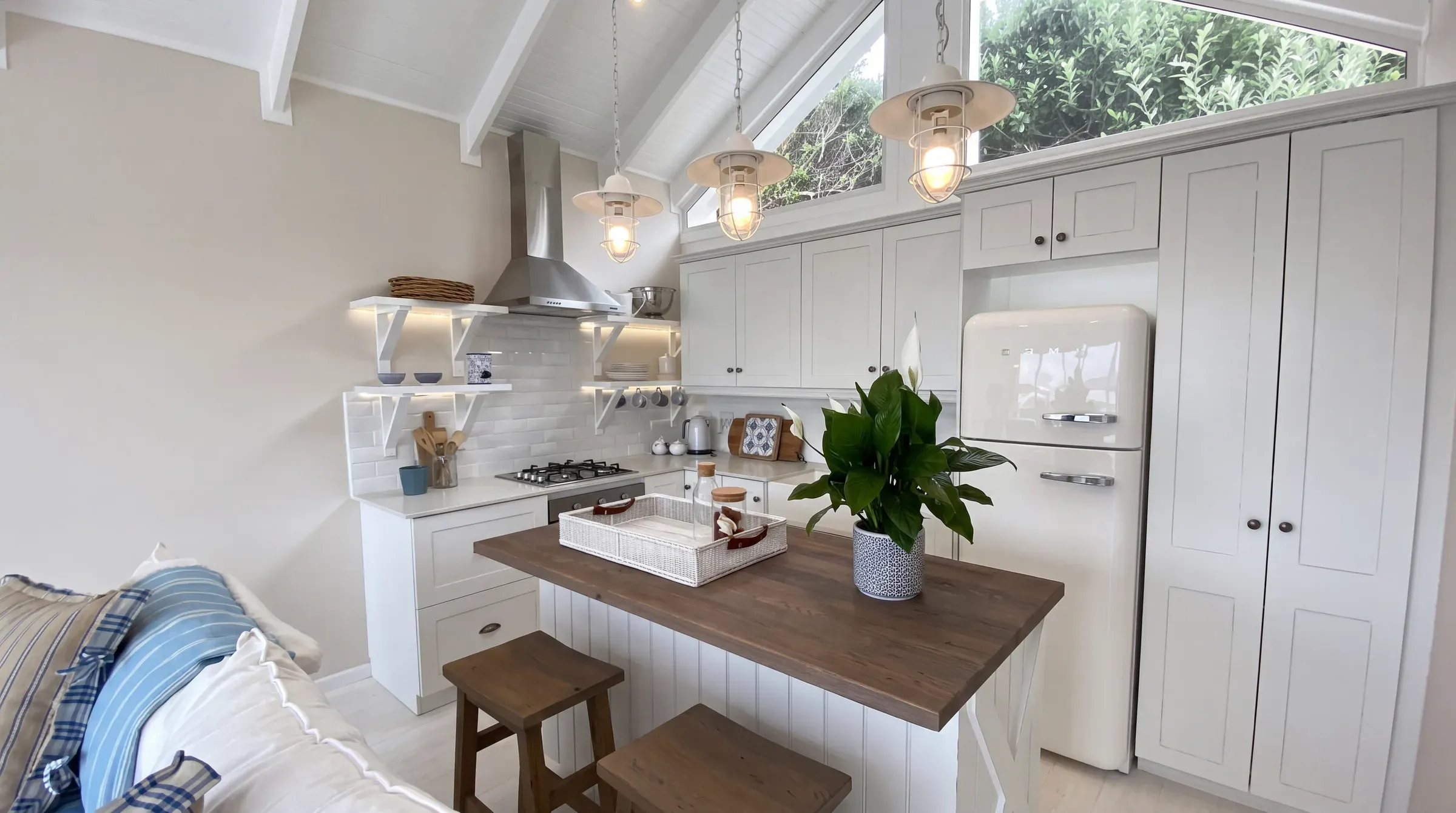 Finished Austin garage conversion with a kitchen island, pale oak floors, and daylight from a skylight