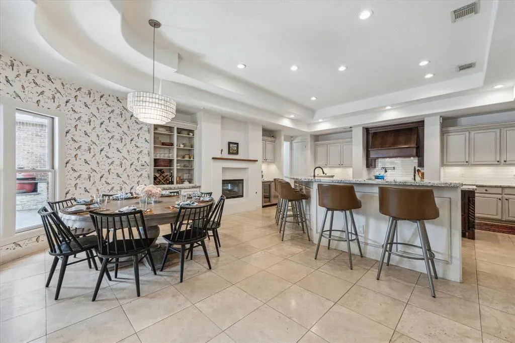 Before: Kitchen remodel in Zilker, Austin, TX with beige tile floors and a dark wood island