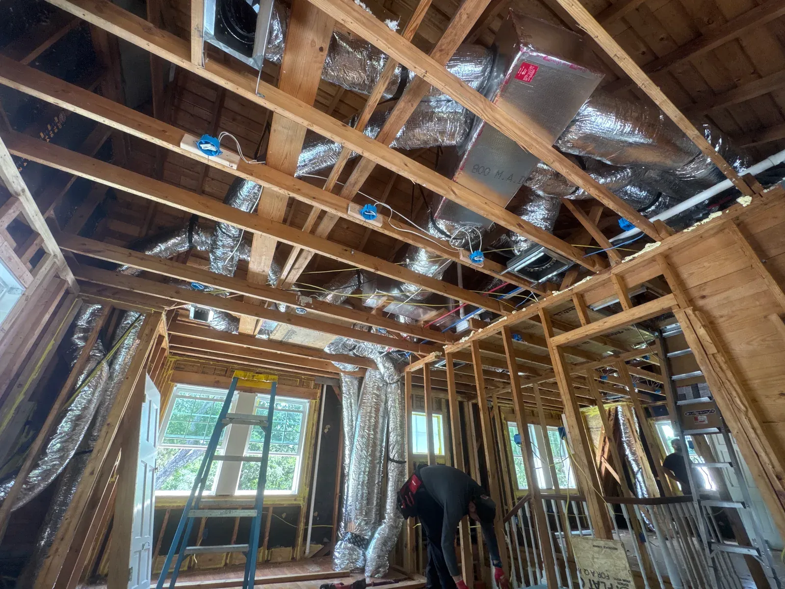 Daily log photo: supply and return ducts run and strapped — Enso Homes Austin