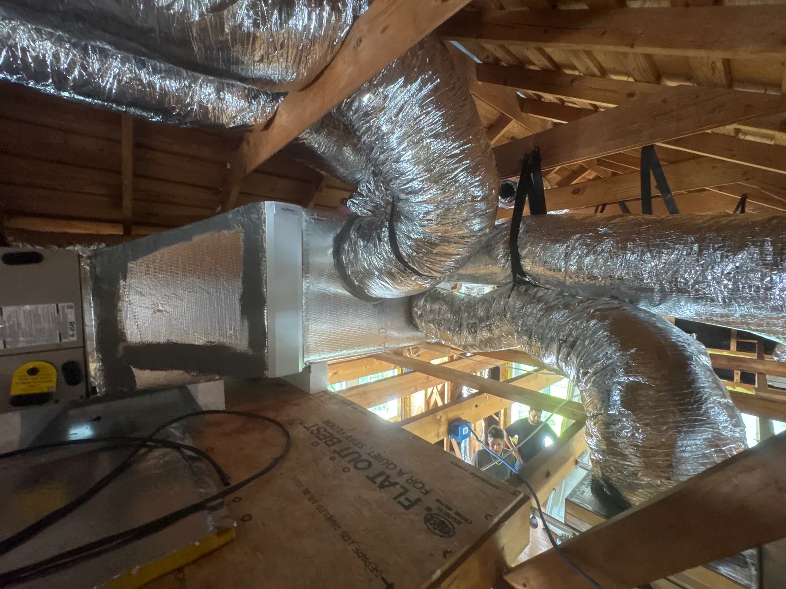Daily log photo: supply and return ducts run and strapped — Enso Homes Austin