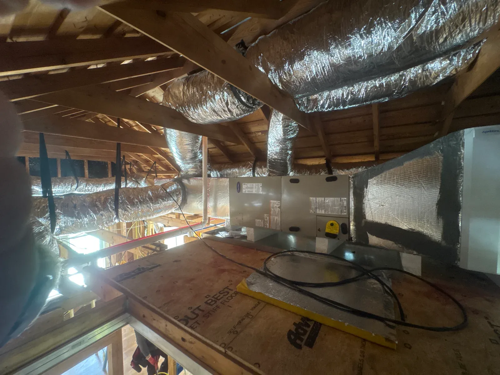Daily log photo: supply and return ducts run and strapped — Enso Homes Austin