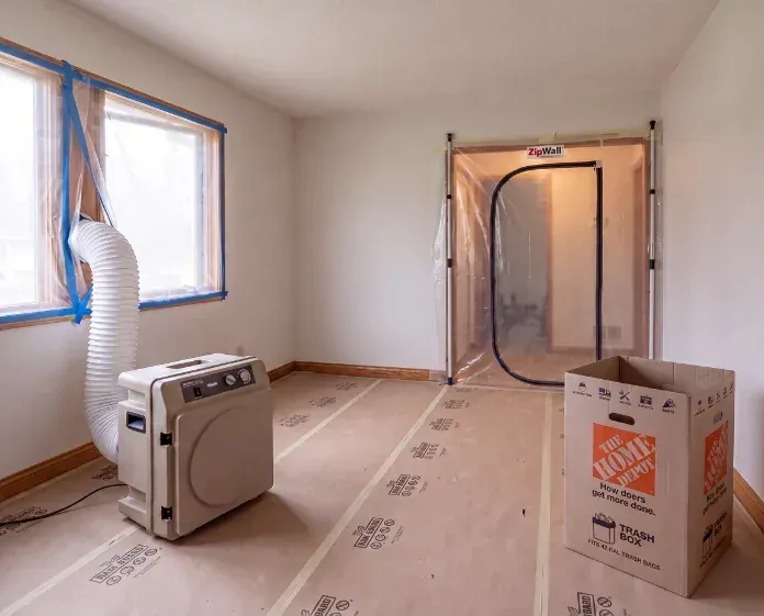 Sealed dust barrier and protected floors on an Enso job site