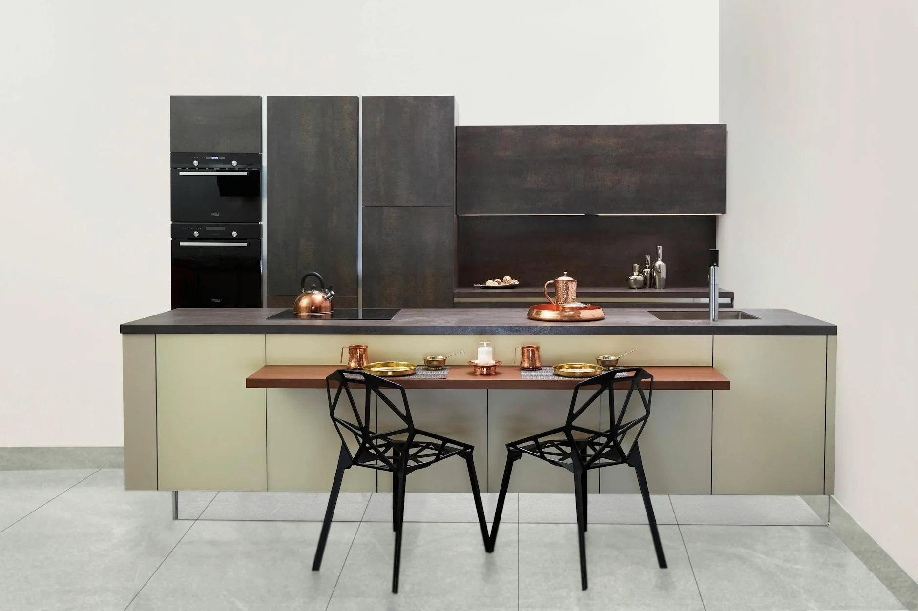 Modern kitchen with dark cabinetry and bronze accents in Mueller
