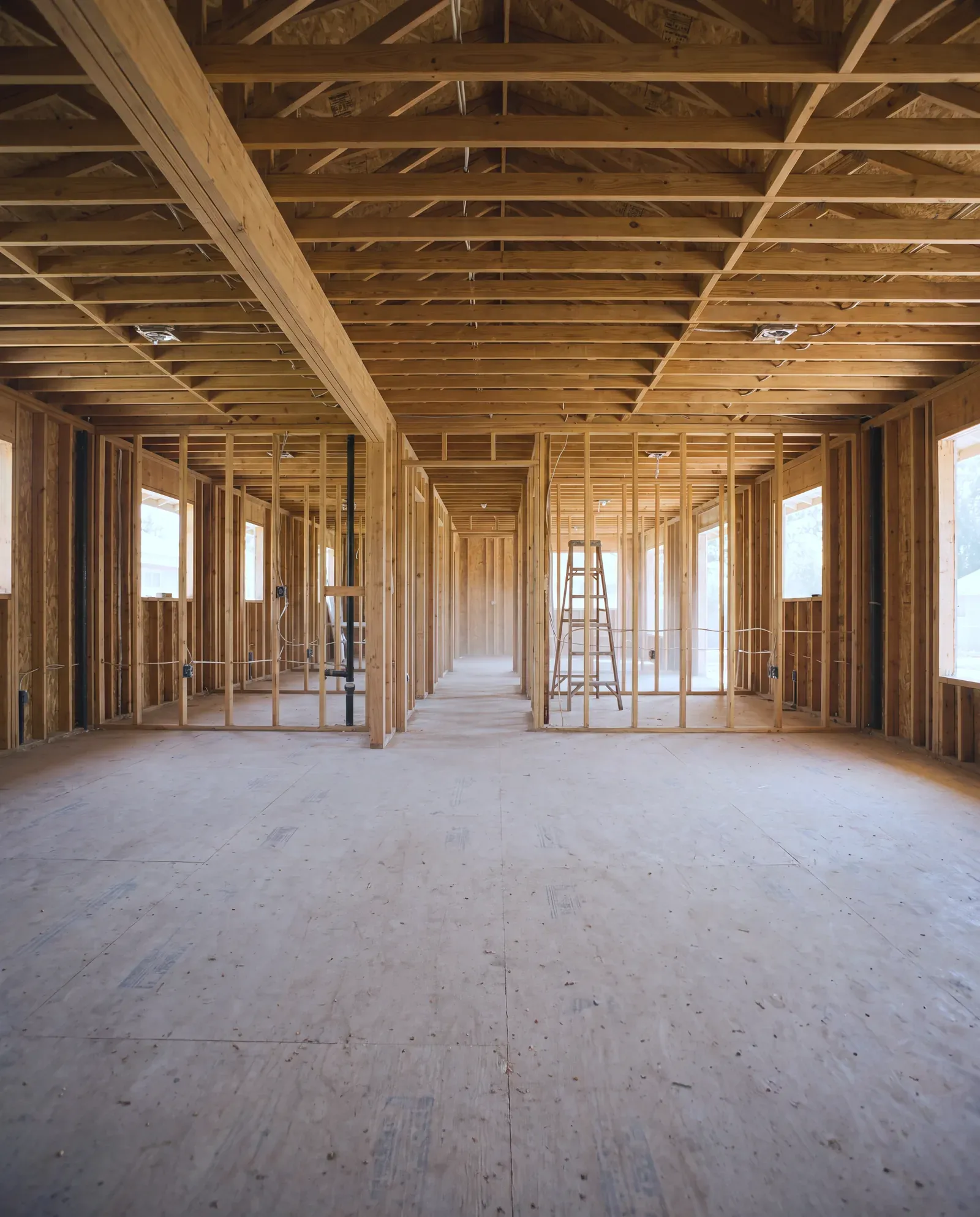 Studs-out interior of an Austin whole-home remodel with open framing throughout and no livable zone